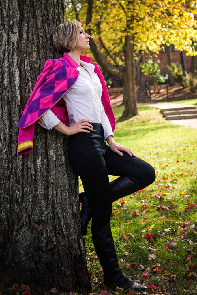 Bri embraces her renaissane faire look which can also pass as a day-wear look with some simple adjustments like switching the boots out for heels that match the vibrant pink, purple, and gold printed blazer